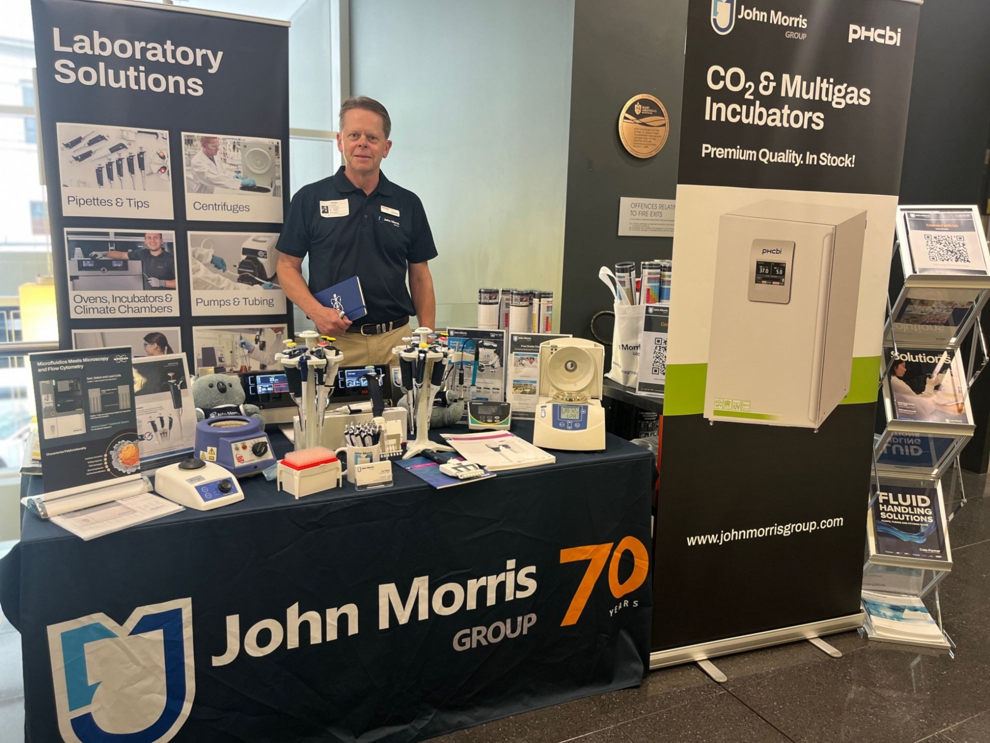 Guy from John Morris Group showcasing lab products